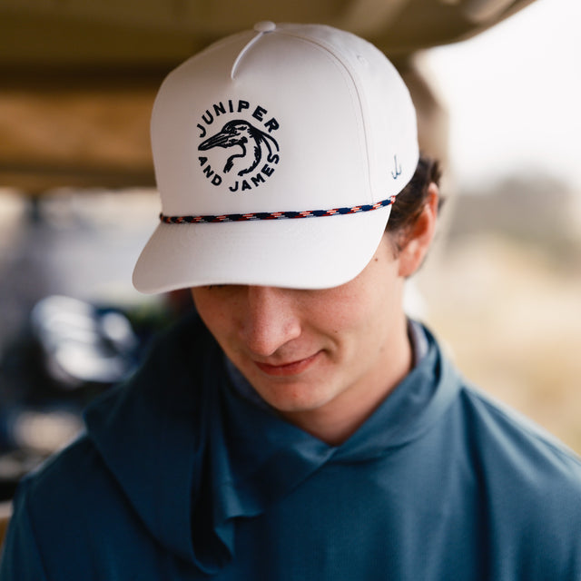 Guy wearing a hat in a golf cart